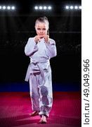 Little girl aikido fighter at sports hall. Стоковое фото, агентство Ingram Publishing / Фотобанк Лори