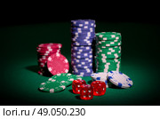 Playing chips and dices on green table. Стоковое фото, агентство Ingram Publishing / Фотобанк Лори