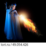 Young elven girl with fire isolated on black. Стоковое фото, агентство Ingram Publishing / Фотобанк Лори