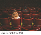 Rear view shot of a man and a woman sitting in an auditorium. Стоковое фото, агентство Ingram Publishing / Фотобанк Лори