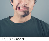 A man with a half shaved beard is pulling faces. Стоковое фото, агентство Ingram Publishing / Фотобанк Лори