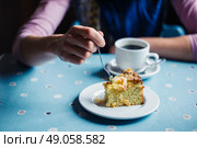 A woman is having coffee and cake in a tearoom. Стоковое фото, агентство Ingram Publishing / Фотобанк Лори