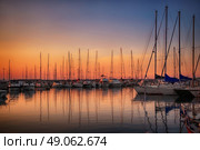 Marina with docked yachts at sunset in Giulianova, Italy. Стоковое фото, агентство Ingram Publishing / Фотобанк Лори