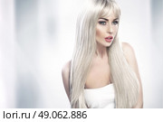 Alluring young lady with long blond hair. Стоковое фото, агентство Ingram Publishing / Фотобанк Лори