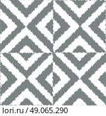 Seamless geometric ikat  pattern vector background tile. Стоковая иллюстрация, агентство Ingram Publishing / Фотобанк Лори