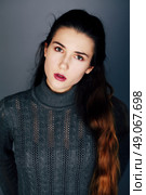 Fashion portrait of attractive sexy fashion model with long natural hair, beautiful eyes, perfect skin and bright lips posing in studio for beauty photo shoot, retouched image. Стоковое фото, агентство Ingram Publishing / Фотобанк Лори