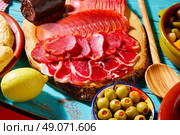 Tapas Iberico ham and lomo sausage olives and morcilla. Стоковое фото, агентство Ingram Publishing / Фотобанк Лори