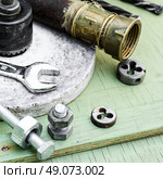 Set of tools to work with. Mounting and threading tool background iron pipes. Стоковое фото, агентство Ingram Publishing / Фотобанк Лори