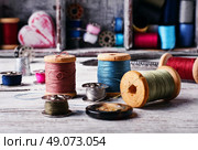 Beads,thread and bobbins for needlework.Selective focus. Стоковое фото, агентство Ingram Publishing / Фотобанк Лори