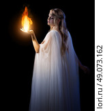 Young elven girl holding fire in palms isolated. Стоковое фото, агентство Ingram Publishing / Фотобанк Лори