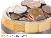 overflowing barrel with various coins. Стоковое фото, агентство Ingram Publishing / Фотобанк Лори