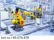 robots in a car plant. robotic arms in a car plant. Стоковое фото, агентство Ingram Publishing / Фотобанк Лори