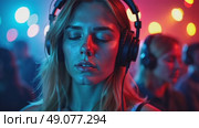 A woman with headphones lost in music, club lights creating colorful patterns across her face, eyes closed in enjoyment. Стоковое AI-видео, аниматор Sergey Grishin / Фотобанк Лори