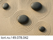 Zen garden smooth river stones with concentric sand ripples symbolizing balance peace mindfulness spa meditation harmony minimalist backdrop. Стоковое AI-изображение, AI-художник Павел Муравьев / Фотобанк Лори
