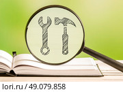 Preferences information with a pencil drawing of tools in a magnifying glass. Стоковое фото, агентство Ingram Publishing / Фотобанк Лори