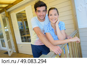 posing in the veranda. Стоковое фото, агентство Ingram Publishing / Фотобанк Лори