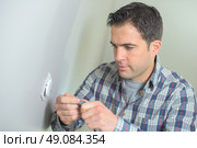 Electrician working on a new build. Стоковое фото, агентство Ingram Publishing / Фотобанк Лори