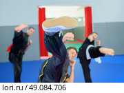 Practising their high-kicks. Стоковое фото, агентство Ingram Publishing / Фотобанк Лори