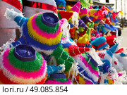 Mexican party pinatas decorated with fringed tissue colorful paper. Стоковое фото, агентство Ingram Publishing / Фотобанк Лори