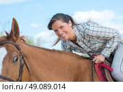 riding a horse. Стоковое фото, агентство Ingram Publishing / Фотобанк Лори