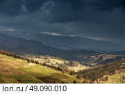 Spring rain in mountains. Thunder and clouds. Стоковое фото, агентство Ingram Publishing / Фотобанк Лори