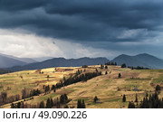 Spring rain in mountains. Thunder and clouds. Стоковое фото, агентство Ingram Publishing / Фотобанк Лори