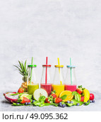 Smoothies  assortment  with fresh ingredients for mixing  on light wooden background, side view. Superfoods and health or detox  diet food concept. Стоковое фото, агентство Ingram Publishing / Фотобанк Лори