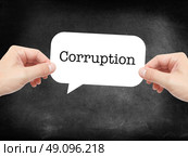 Corruption written on a speechbubble. Стоковое фото, агентство Ingram Publishing / Фотобанк Лори