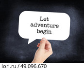 Let Adventure begin written on a speechbubble. Стоковое фото, агентство Ingram Publishing / Фотобанк Лори