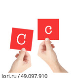 Cc written on cards held by hands. Стоковое фото, агентство Ingram Publishing / Фотобанк Лори