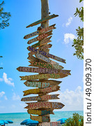 Key West beach distance signs to worldwide landmarks Florida USA Fort Zachary Taylor. Стоковое фото, агентство Ingram Publishing / Фотобанк Лори