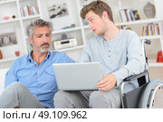 father and disabled son. Стоковое фото, агентство Ingram Publishing / Фотобанк Лори