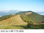 Old wooden house in a mountain valley. Autumn Carpathians landscape in the morning. . Стоковое фото, агентство Ingram Publishing / Фотобанк Лори