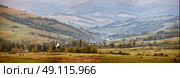 Cloudy autumn panorama in mountain hills. Village in October valley. Стоковое фото, агентство Ingram Publishing / Фотобанк Лори