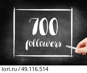700 followers written on a blackboard. Стоковое фото, агентство Ingram Publishing / Фотобанк Лори