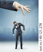 Conceptual photo of controlled employee. Стоковое фото, агентство Ingram Publishing / Фотобанк Лори
