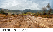 Muddy ground after rain in Carpathian mountains. Extreme path rural dirt road in the hills. Стоковое фото, агентство Ingram Publishing / Фотобанк Лори