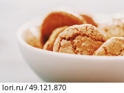 Italian Amaretti Biscuits In White Bowl. Стоковое фото, агентство Ingram Publishing / Фотобанк Лори