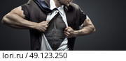 Muscular businessman tearing up his tuxedo. Стоковое фото, агентство Ingram Publishing / Фотобанк Лори
