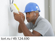 repairing household power changing a light switch. Стоковое фото, агентство Ingram Publishing / Фотобанк Лори