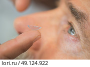 male eye with contact lens close up. Стоковое фото, агентство Ingram Publishing / Фотобанк Лори
