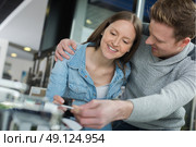 young couple fixing a devise at home. Стоковое фото, агентство Ingram Publishing / Фотобанк Лори