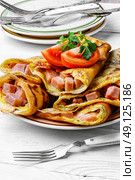 Pancakes for Shrove Tuesday. Tasty pancakes stuffed with meat and mushrooms on the plate. Стоковое фото, агентство Ingram Publishing / Фотобанк Лори