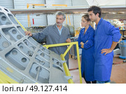 apprentices with professional metallurgist. Стоковое фото, агентство Ingram Publishing / Фотобанк Лори
