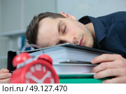 pleasant man sleeping in the office. Стоковое фото, агентство Ingram Publishing / Фотобанк Лори