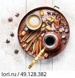 coffee and many coffee spices. cezve and cup of coffee in copper tray with oriental spices. Стоковое фото, агентство Ingram Publishing / Фотобанк Лори