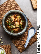Chinese Sichuan soup with tofu and meat served in bowl , top view. Asian cuisine. Стоковое фото, агентство Ingram Publishing / Фотобанк Лори