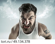 Portrait of a really furious man. Стоковое фото, агентство Ingram Publishing / Фотобанк Лори