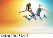 Two talented dancers practising in large studio. Стоковое фото, агентство Ingram Publishing / Фотобанк Лори