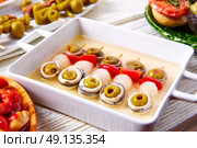 Olives anchovies and picked onion red pepper pinchos tapas from Spain. Стоковое фото, агентство Ingram Publishing / Фотобанк Лори